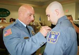 Officer Nicholas Brady receives badge from Chief McCormick (1024x723)